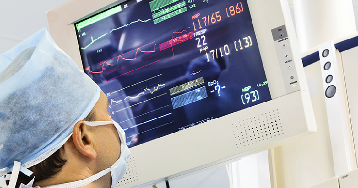 surgeon looking at a monitor