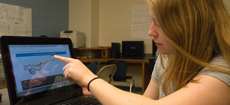 Person touching a computer screen